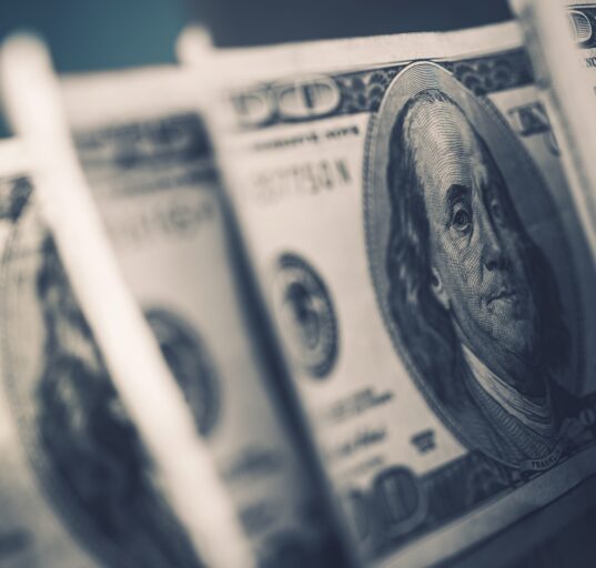 American Dollars in Focus. Benjamin Franklin One Hundred Dollars Banknotes. Dollar Trading.