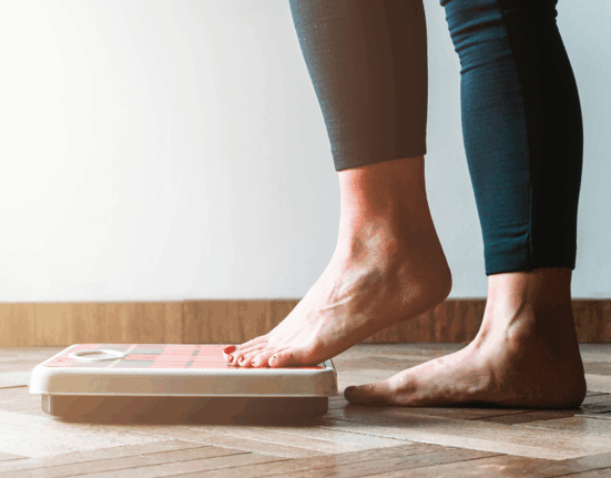 Person stepping on a scale